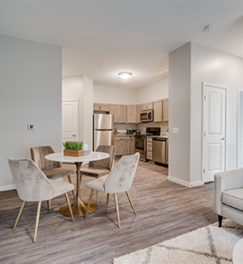a child on her mother's back. both are smiling.
