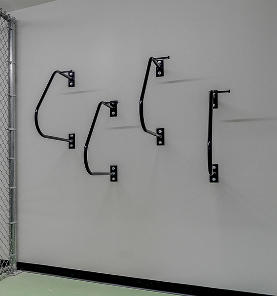 a young man smiling and leaning on his bicycle holding his cellphone